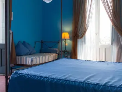 Letto o letti in una camera di Etna Hotel