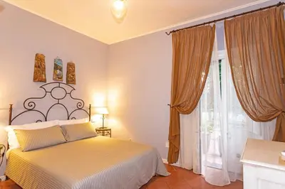 Letto o letti in una camera di Etna Hotel