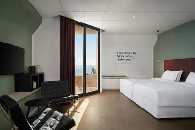 Letto o letti in una camera di Four Points by Sheraton Catania Hotel