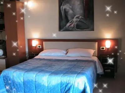 Letto o letti in una camera di B&B Suite