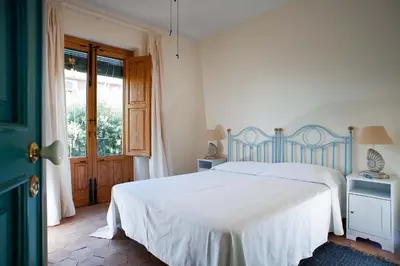 Letto o letti in una camera di Torre Archirafi