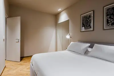 Letto o letti in una camera di Ferrini Home - Etnea Heritage