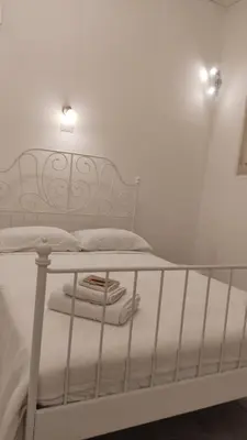 Letto o letti in una camera di Vicolo Stretto