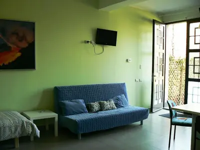 Area soggiorno di Etna Holiday Home