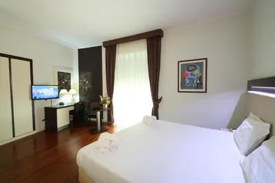Letto o letti in una camera di Grande Albergo Maugeri