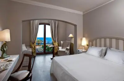 Letto o letti in una camera di Grand Hotel Baia Verde