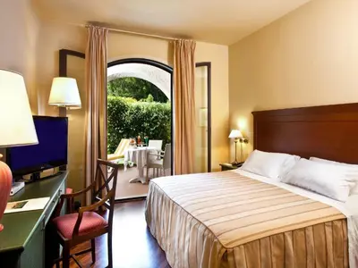 Letto o letti in una camera di Grand Hotel Baia Verde