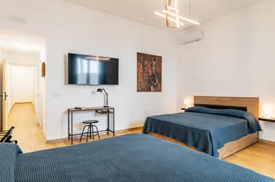 Letto o letti in una camera di Aurora Rooms