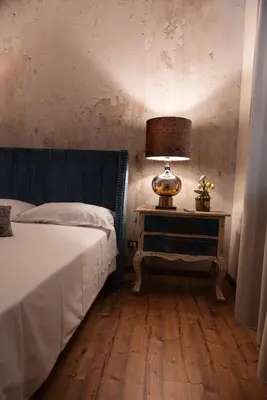 Letto o letti in una camera di B&B Donna Cinzia