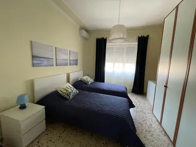 Letto o letti in una camera di Tra il nero e il blu - appartamento
