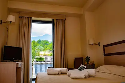 Letto o letti in una camera di Hotel Milomax