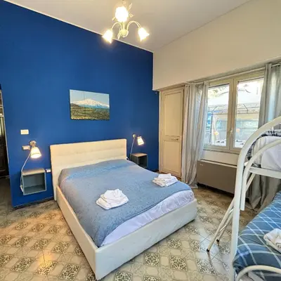 Letto o letti in una camera di Althea Etna Garden