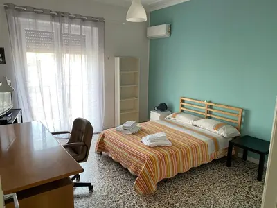 Letto o letti in una camera di Giuffrida Apartment Rooms