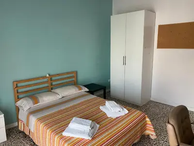 Letto o letti in una camera di Giuffrida Apartment Rooms