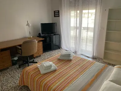 Letto o letti in una camera di Giuffrida Apartment Rooms