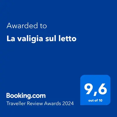 Certificato, attestato, insegna o altro documento esposto da La valigia sul letto