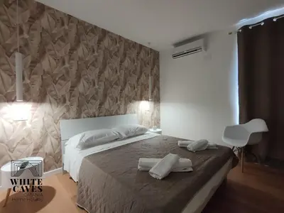 Letto o letti in una camera di white caves catania home holiday