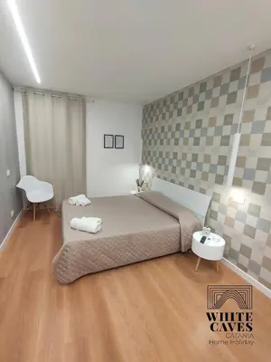 Letto o letti in una camera di white caves catania rooms