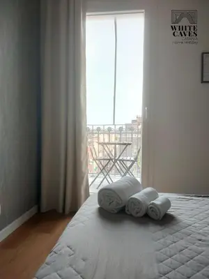 Letto o letti in una camera di white caves catania rooms