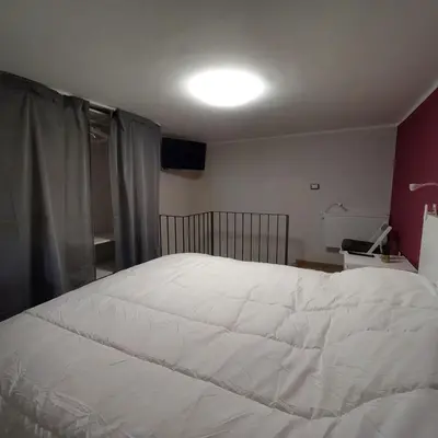 Letto o letti in una camera di Etna Home
