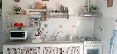 Cucina o angolo cottura di Casa Leo, eleganza Siciliana con vista Etna a due passi dal Mare