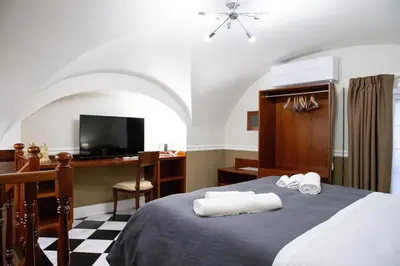Letto o letti in una camera di Borgo Santa Caterina
