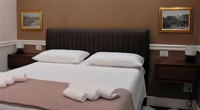 Letto o letti in una camera di Borgo Santa Caterina