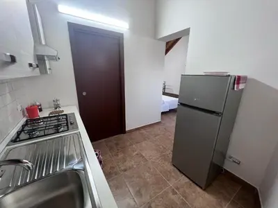 Cucina o angolo cottura di Esclusivo Cortile Duca D'Aosta ai piedi dell'ETNA