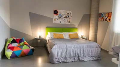 Letto o letti in una camera di Etna Suite Design Apartments