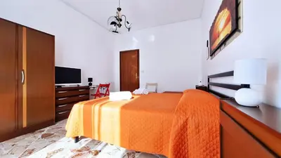 Letto o letti in una camera di Casa Iolanda
