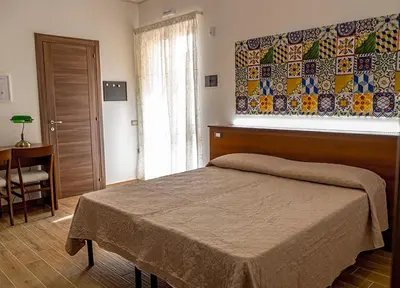 Letto o letti in una camera di ZAHRA AGRITURISMO