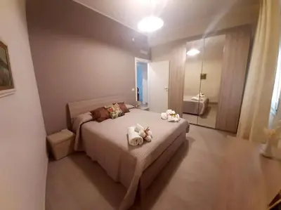 Letto o letti in una camera di Nichila - Casa Vacanze acitrezza