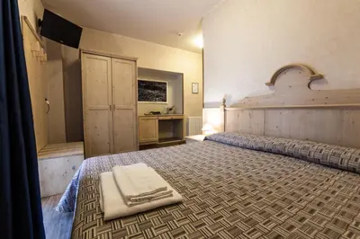 Letto o letti in una camera di Rifugio Sapienza