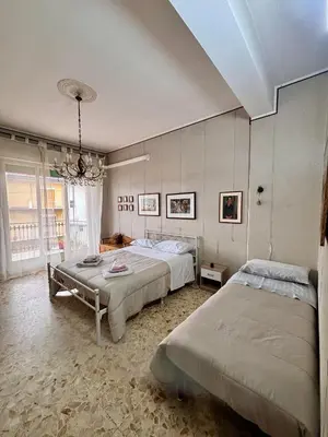 Letto o letti in una camera di Appartamento turistico Giarre Offre Camera in condivisione Euro 300 al mese