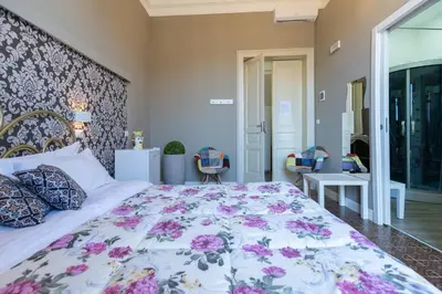 Letto o letti in una camera di Tra l'Etna e il mare via Oberdan