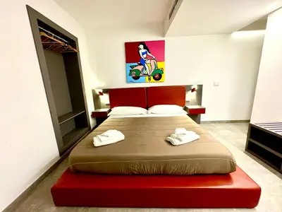 Letto o letti in una camera di City Suites at Cortile Nobile