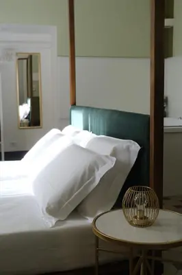 Letto o letti in una camera di Toscano Palace Luxury Rooms Catania