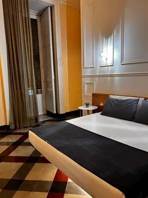 Letto o letti in una camera di Toscano Palace Luxury Rooms Catania