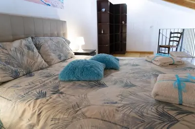 Letto o letti in una camera di Li Cuti House - Lungomare Self Check-in