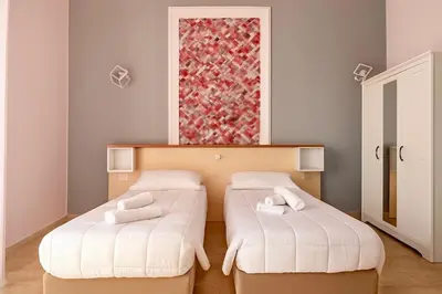 Letto o letti in una camera di Margherita Rooms