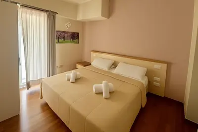 Letto o letti in una camera di Margherita Rooms