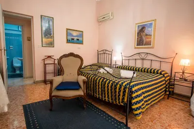 Letto o letti in una camera di Aci B&B