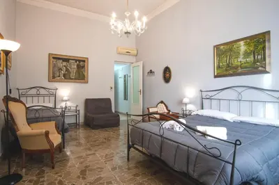 Letto o letti in una camera di Aci B&B