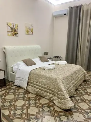 Letto o letti in una camera di Genuardi’s apartment