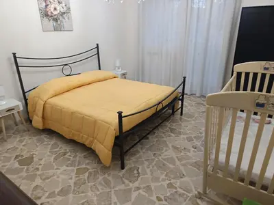 Letto o letti in una camera di New Dawn Apartment, Appartamento Turistico, casa per vacanza, tre camere indipendenti