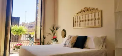 Letto o letti in una camera di GLI APPARTAMENTI DI PALAZZO UMBERTO I