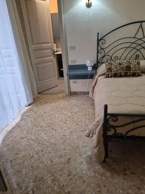Letto o letti in una camera di GLI APPARTAMENTI DI PALAZZO UMBERTO I