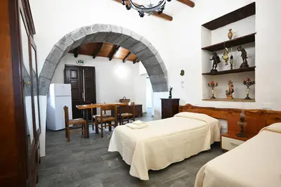 Letto o letti in una camera di Agriturismo Gli Aranci dell'Etna