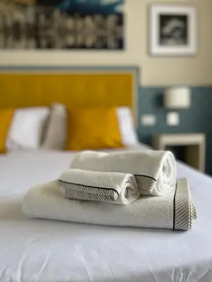 Letto o letti in una camera di MB Giurati Suites