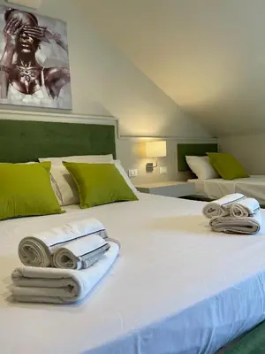 Letto o letti in una camera di MB Giurati Suites